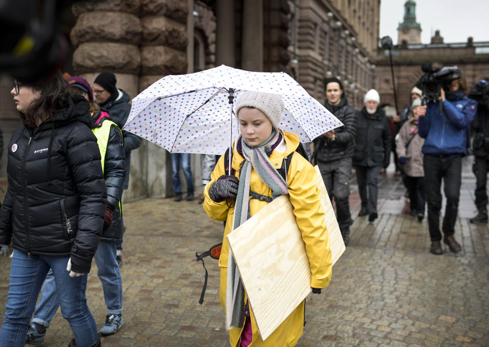 Activist Greta Thunberg, foreground, participates in a climate protest, in central Stockholm Sweden, Friday, March 15, 2019. Students worldwide skipped classes Friday to take to the streets to protest their governments' failure to take sufficient action against global warming. (Pontus Lundahl/TT News Agency via AP)