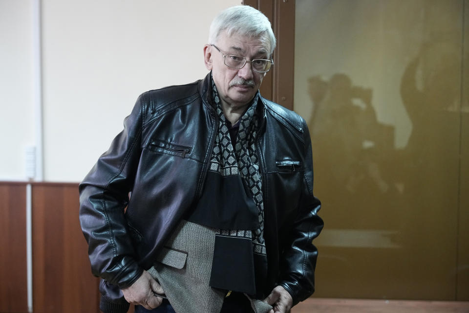 Oleg Orlov, a member of the Board of the International Historical Educational Charitable and Human Rights Society 'Memorial' (International Memorial) stands at a courtroom prior to a session in Moscow, Russia, Wednesday, Oct. 11, 2023. Orlov, the co-chair of the Nobel Peace Prize-winning human rights group Memorial, is on trial on charges of 