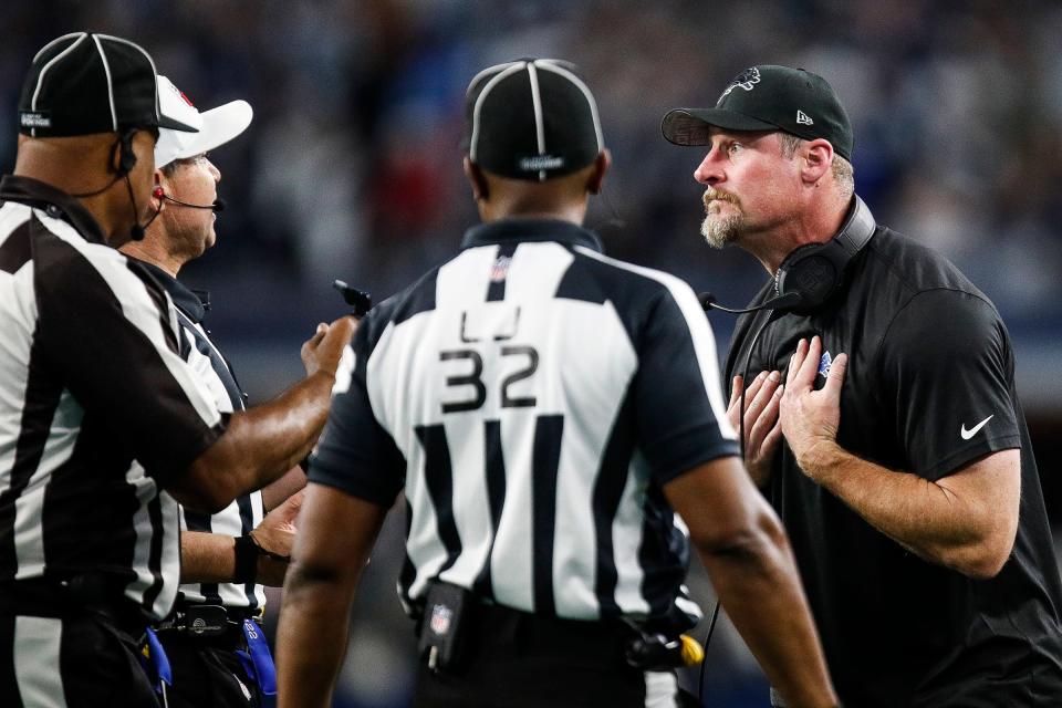 Lions coach Dan Campbell talks to referees regarding offensive tackle Taylor Decker's 2-point conversion catch being called illegal touching during the second half of the Lions' 20-19 loss at AT&T Stadium in Arlington, Texas on Saturday, Dec. 30, 2023.