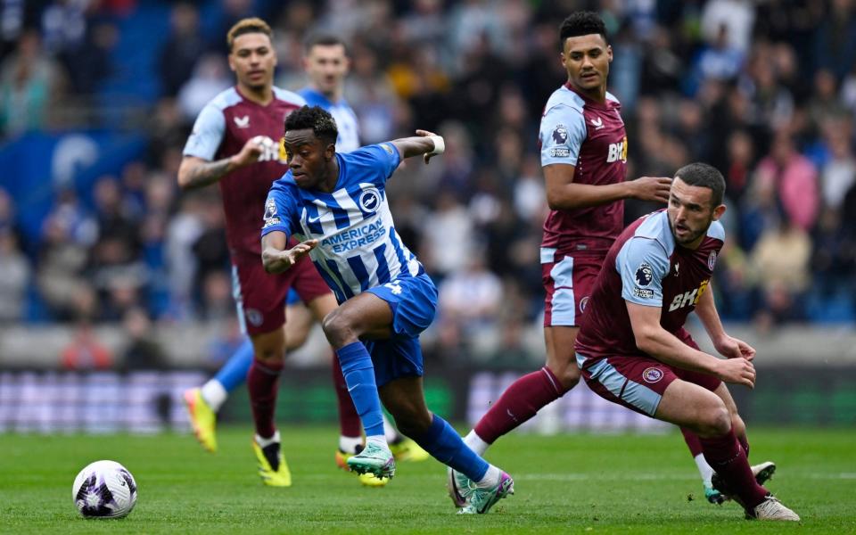 Aston Villa's Ollie Watkins and John McGinn in action with Brighton & Hove Albion's