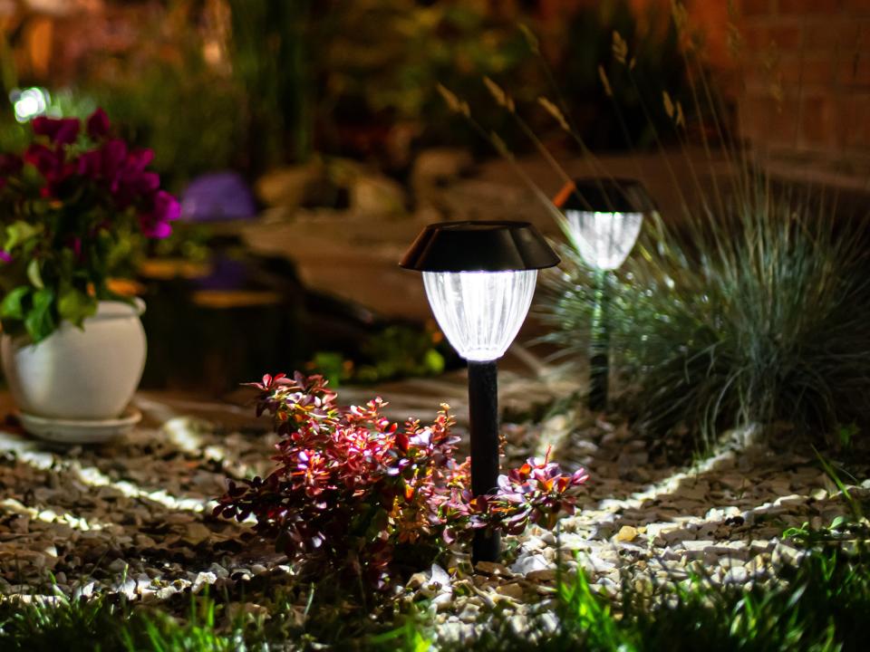 Patio lights shining bright in terrace at night