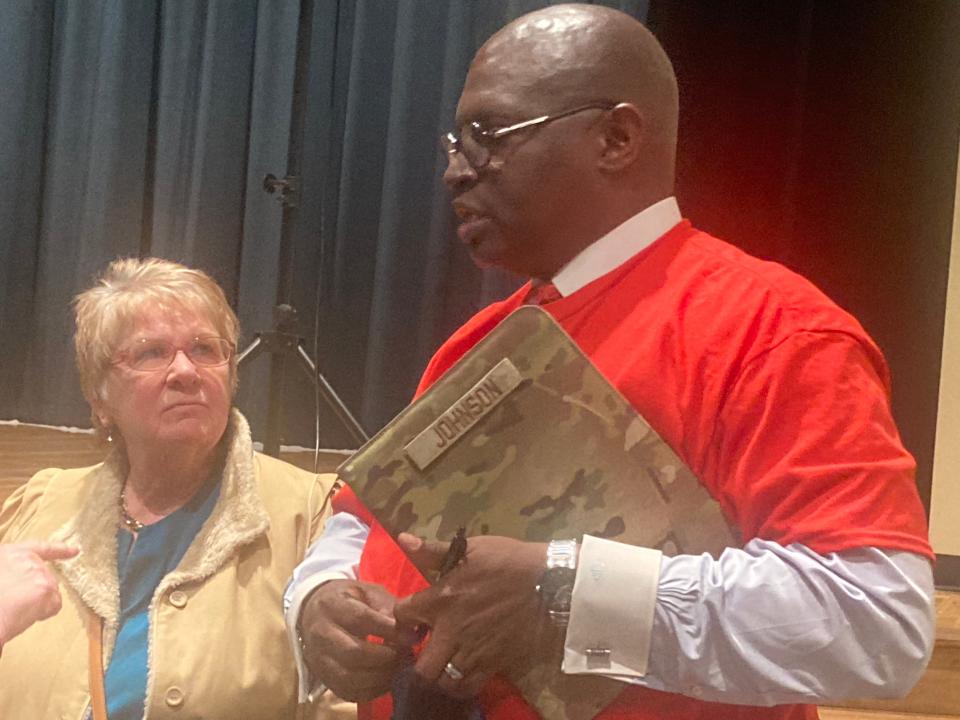 Spurgeon Johnson, right, talks after Tuesday's "Meet the Candidates" forum sponsored by the Springfield Education Association at Southeast High School. Johnson is running against Sarah Blissett and Jessica Bandy in the April 4 consolidated election.