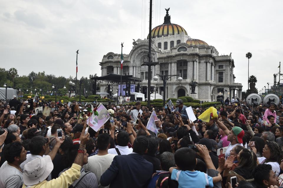 People gather outside the Palace of Fine Arts to pay tribute to Mexico's late Latin music legend Juan Gabriel, in Mexico City, on Sept. 5.&nbsp;