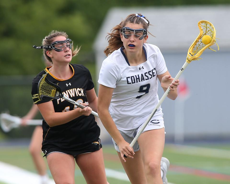 Cohasset's Libby Schiffmann looks to sprint past Bishop Fenwick’s Lauren Woods during first half action of their Sweet 16 game against Bishop Fenwick in the Division 3 State Tournament at Cohasset High on Wednesday, June 7, 2023. 
