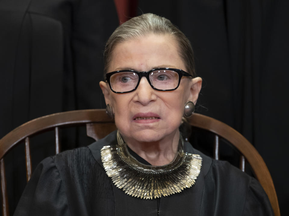 FILE - In this Nov. 30, 2018 file photo, Associate Justice Ruth Bader Ginsburg, nominated by President Bill Clinton, sits with fellow Supreme Court justices for a group portrait at the Supreme Court Building in Washington, Friday. The Supreme Court says Ginsburg has died of metastatic pancreatic cancer at age 87. (AP Photo/J. Scott Applewhite, File)