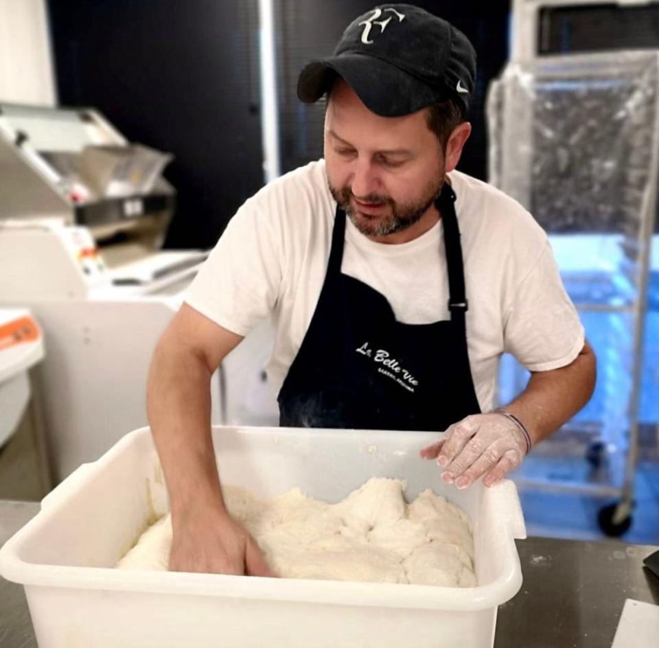 Nathas Kraus of La Belle Vie coaxes the dough.