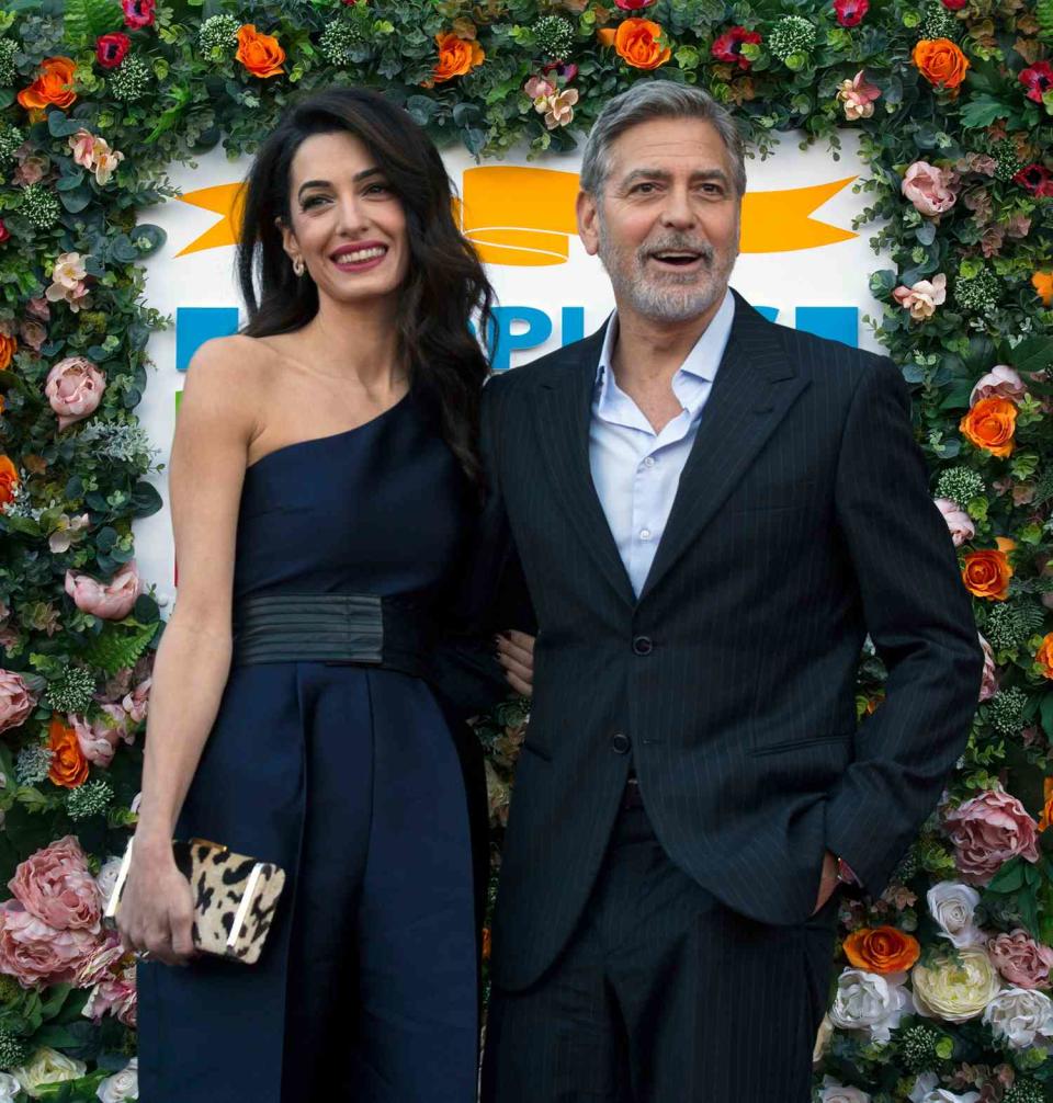George and Amal Clooney, representing the Clooney Foundation for Justice, arrive at the People's Postcode Lottery charity gala at the McEwan Hall in Edinburgh