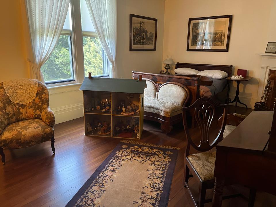 A room with a dollhouse at Locust Grove.