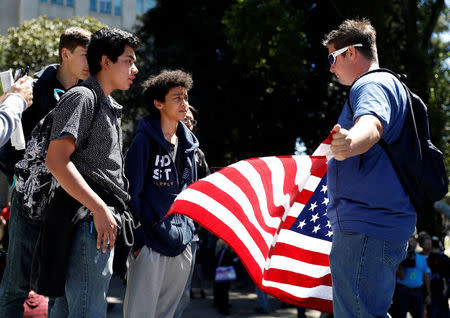 Opposing factions gather over the cancelation of conservative commentator Ann Coulter's speech at the University of California, Berkeley, in Berkeley, California, U.S., April 27, 2017. REUTERS/Stephen Lam
