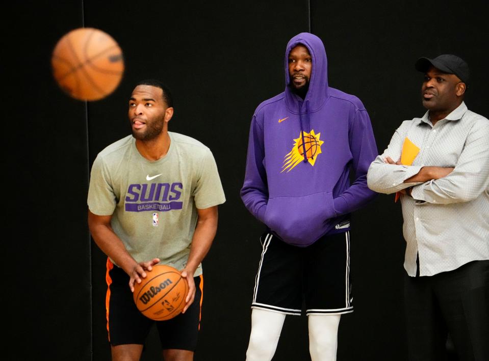 Phoenix Suns forward Kevin Durant watches forward T.J. Warren shoot during practice on May 4, 2023, as the team prepares for Game 3 of the Western Conference Semifinals against the Denver Nuggets.