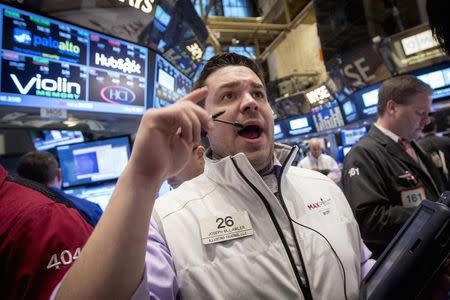 Trader Joseph Lawler works on the floor of the New York Stock Exchange March 6, 2015. REUTERS/Brendan McDermid