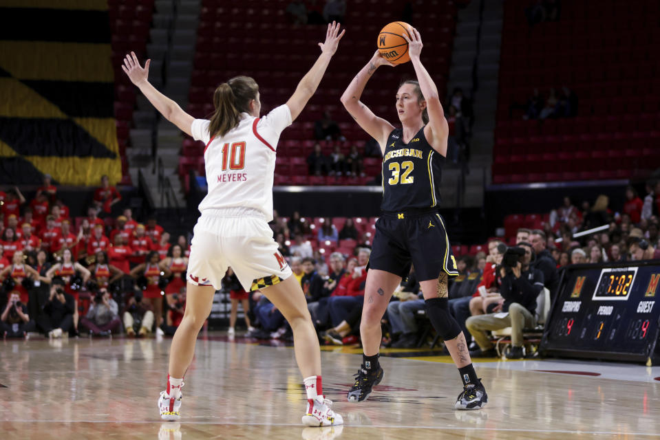 Maryland guard Abby Meyers (10) guards Michigan guard Leigha Brown (32) during the first half of an NCAA college basketball game Thursday, Jan. 26, 2023, in College Park, Md. (AP Photo/Julia Nikhinson)