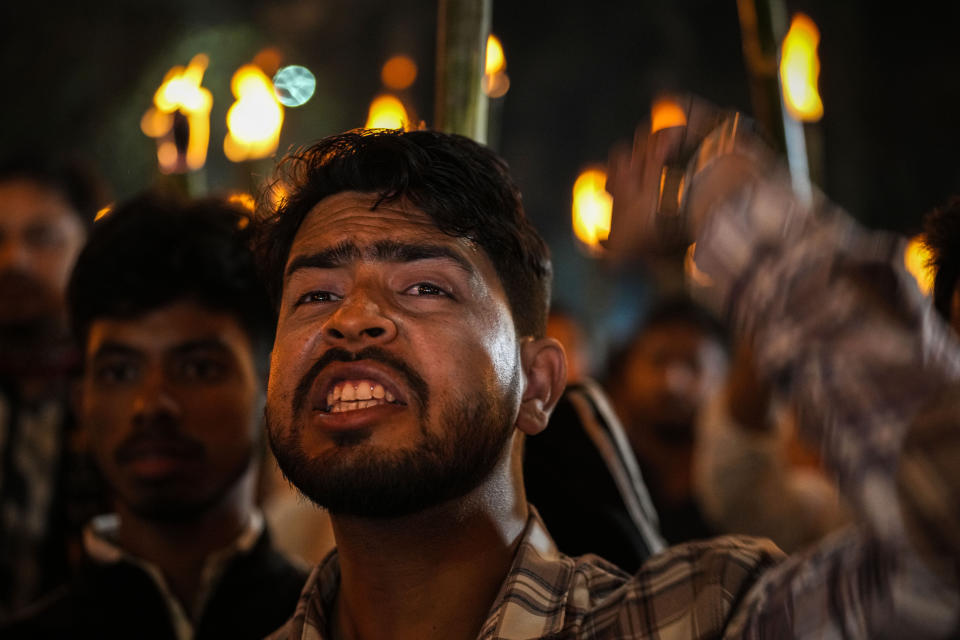 All Assam Students Union (AASU) members take out a torch procession to protest against the Citizenship Amendment Act (CAA) in Guwahati, India, Tuesday, March 12, 2024. India has implemented a controversial citizenship law that has been widely criticized for excluding Muslims, a minority community whose concerns have heightened under Prime Minister Narendra Modi's Hindu nationalist government. The act provides a fast track to naturalization for Hindus, Parsis, Sikhs, Buddhists, Jains and Christians who fled to Hindu-majority India from Afghanistan, Bangladesh and Pakistan before Dec. 31, 2014. (AP Photo/Anupam Nath)