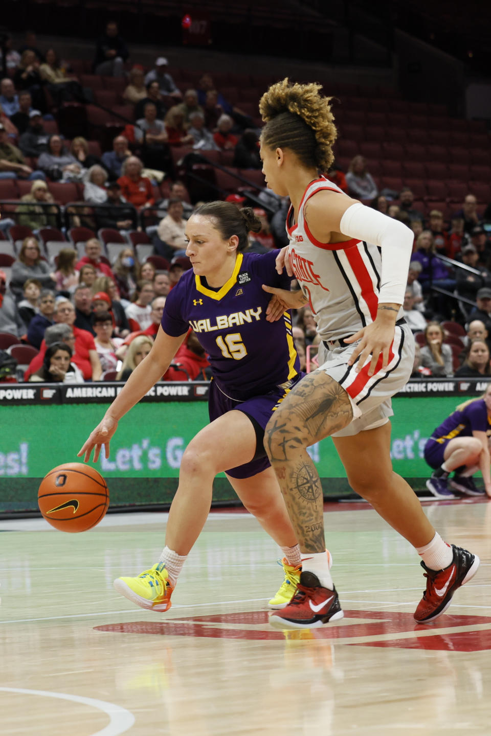 Albany's Morgan Haney, left, drives the lane against Ohio State's Rikki Harris during the first half of an NCAA college basketball game on Friday, Dec. 16, 2022, in Columbus, Ohio. (AP Photo/Jay LaPrete)