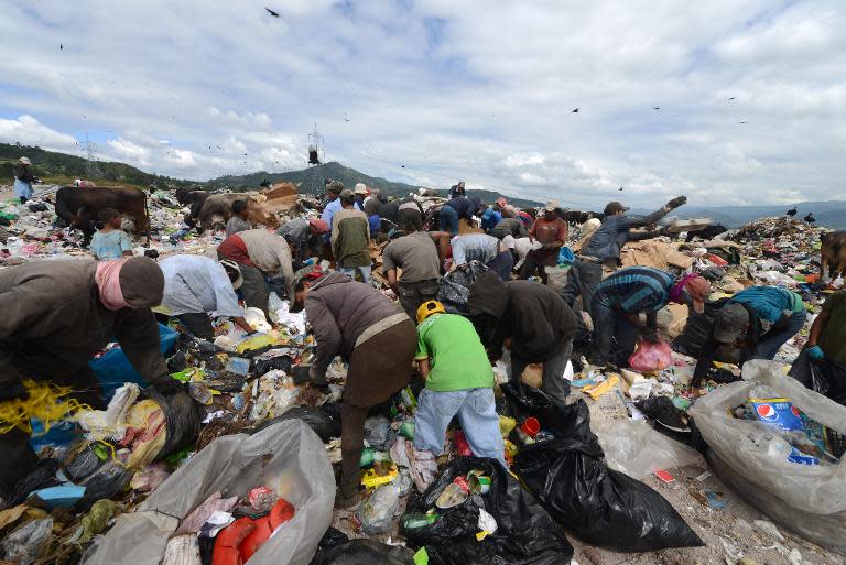 Honduras plans to sign up 25,000 youths each year to its "Guardians of the Nation" to stop them scavenging for food amid the garbage near Tegucigalpa