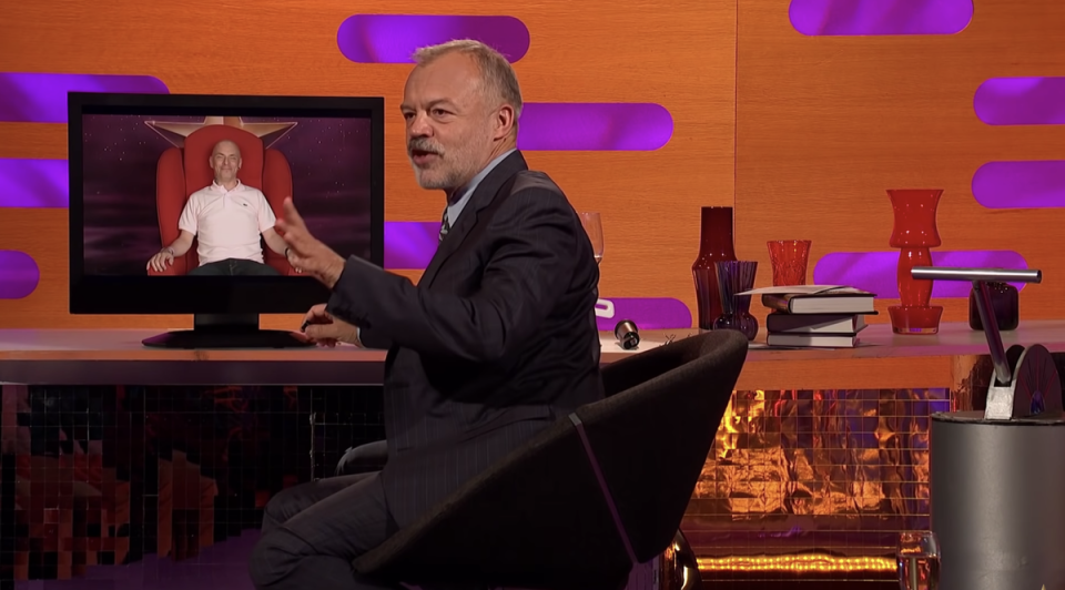 Graham Norton controlling the Red Chair (BBC The Graham Norton Show)