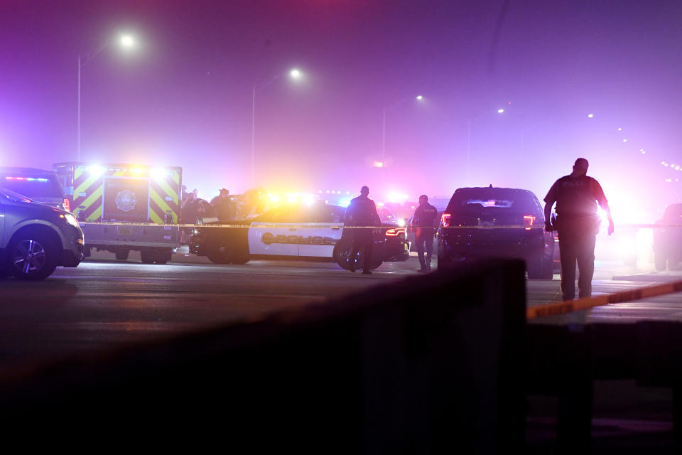 FILE - In this Dec. 5, 2019 file photo authorities investigate the scene of a shooting in Miramar, Fla. Four Florida police officers have been indicted in connection with a 2019 shootout on a busy street that left a UPS driver, the two robbers who hijacked him and a nearby driver dead, their union confirmed Tuesday, June 11, 2024. (Taimy Alvarez/South Florida Sun-Sentinel via AP, file)