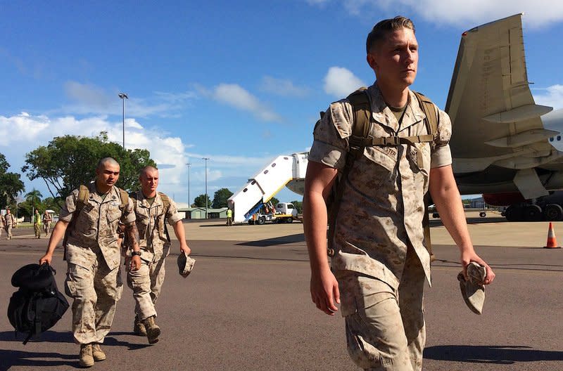 U.S. Marines walk after disembarking a plane after they arrived for the sixth annual Marines' deployment at Darwin in northern Australia, April 18, 2017.      REUTERS/Tom Westbrook