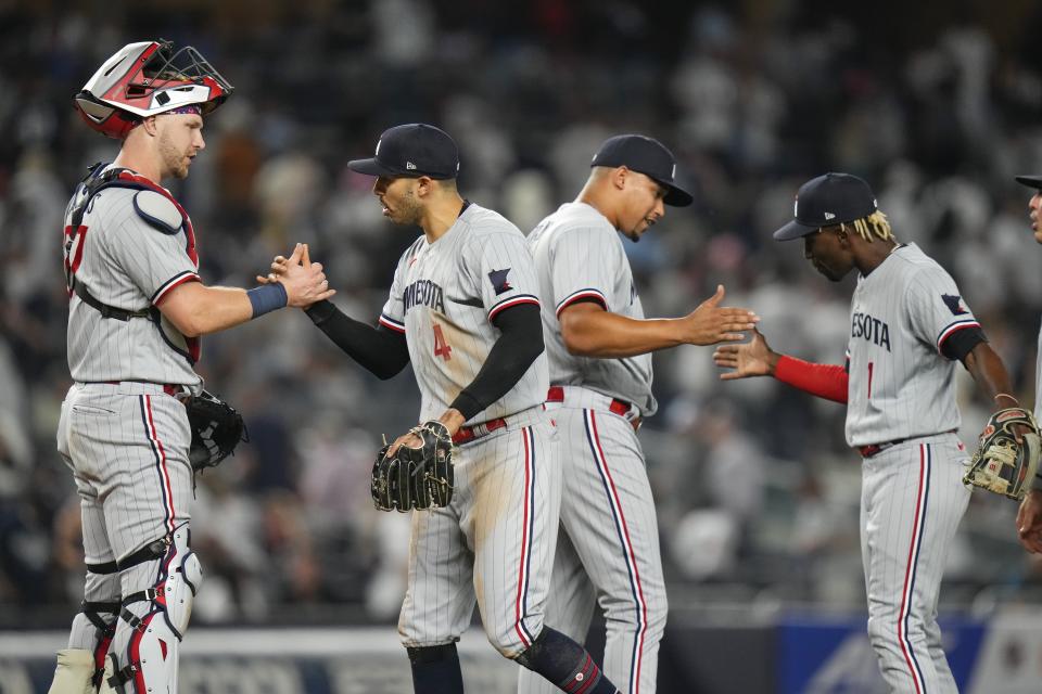 Minnesota Twins' Ryan Jeffers, left, Carlos Correa, second from left, Jhoan Duran and Nick Gordon, right, celebrate the team's 4-3 win in a baseball game against the New York Yankees on Friday, April 14, 2023, in New York. (AP Photo/Frank Franklin II)