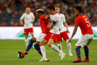 Soccer Football - International Friendly - Poland vs Chile - INEA Stadion, Poznan, Poland - June 8, 2018 Chile’s Junior Fernandes in action with Poland's Robert Lewandowski REUTERS/Kacper Pempel