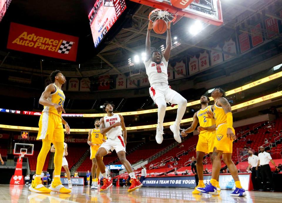 N.C. State’s D.J. Funderburk (0) reacts after slamming in two during N.C. State’s 65-62 victory over Pittsburgh at PNC Arena in Raleigh, N.C., Sunday, February 28, 2021.