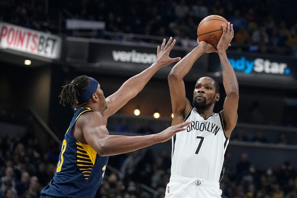 Brooklyn Nets' Kevin Durant (7) shoots over Indiana Pacers' Myles Turner (33) during the first half of an NBA basketball game Wednesday, Jan. 5, 2022, in Indianapolis.