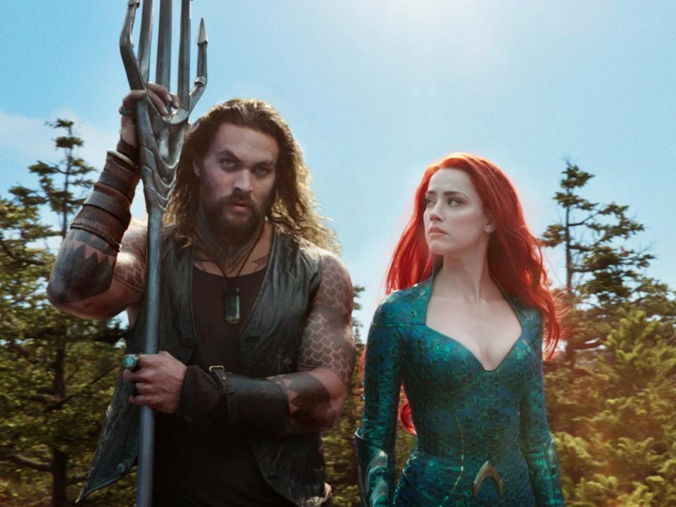 Jason Momoa as Arthur Curry and Amber Heard as Mera in "Aquaman."