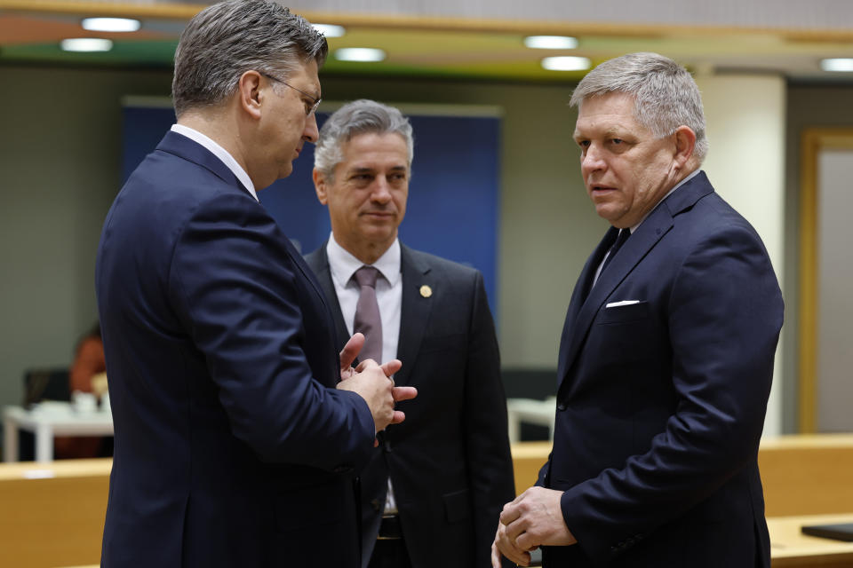 Slovakia's Prime Minister Robert Fico, right, talks to Croatia's Prime Minister Andrej Plenkovic, left, and Slovenia's Prime Minister Robert Golob during a round table meeting at an EU summit in Brussels, Thursday, Feb. 1, 2024. European Union leaders meet in Brussels for a one day summit to discuss the revision of the Multiannual Financial Framework 2021-2027, including support for Ukraine. (AP Photo/Geert Vanden Wijngaert)