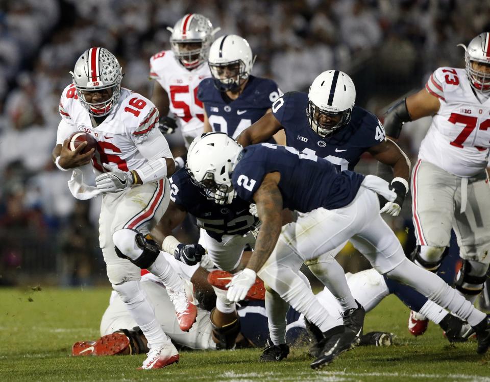 Penn State had pressure in the face of Ohio State QB J.T. Barrett all night. (AP Photo/Chris Knight)