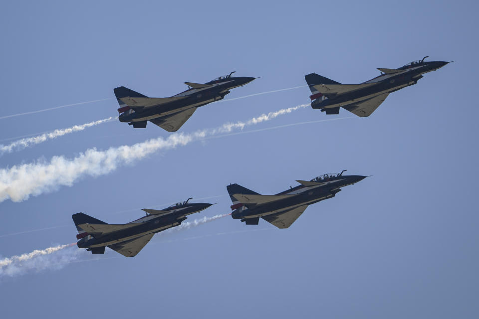 ZHUHAI,CHINA - NOVEMBER 10: J-10 fighter jets of Chinese air force's August 1 Aerobatic Team perform during the 2022 Airshow on November 10, 2022 in Zhuhai, Guangdong province of China. The 14th Airshow China will be held from Nov. 8 to 13. (Photo by Stringer/Anadolu Agency via Getty Images)