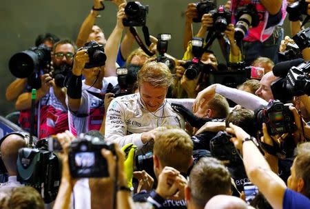 Formula One - F1 - Singapore Grand Prix - Marina Bay, Singapore- 18/9/16 Mercedes' Nico Rosberg of Germany celebrates winning the race . REUTERS/Jeremy Lee