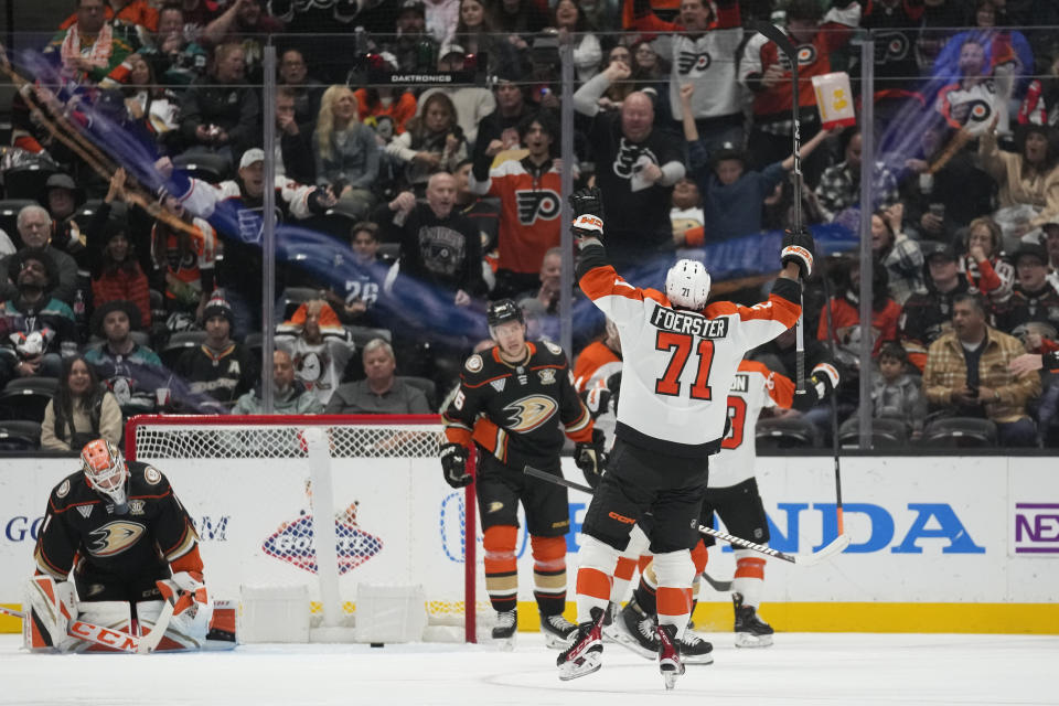 Philadelphia Flyers right wing Tyson Foerster (71) celebrates after center Sean Couturier scored during the first period of an NHL hockey game against the Anaheim Ducks in Anaheim, Calif., Friday, Nov. 10, 2023. (AP Photo/Ashley Landis)