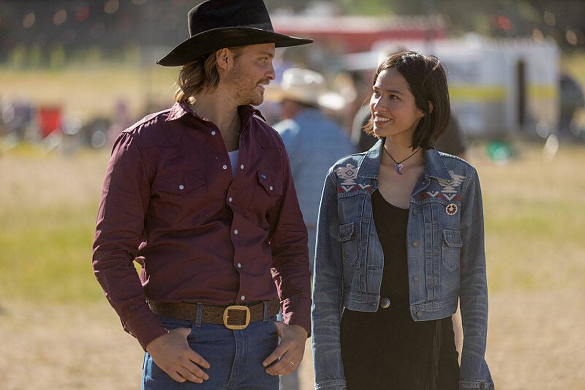 Kayce and Monica Dutton, played by Luke Grimes and Kelsey Asbille, enjoy a trip to the county fair in Season 5, episode 7 of “Yellowstone.”