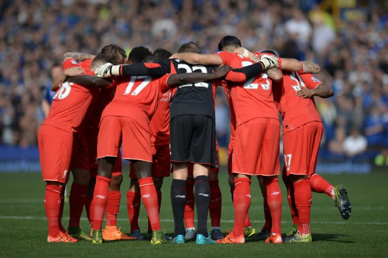 Liverpool's Belgian goalkeeper Simon Mignolet (C) huddles with teammates ahead of the English Premier League football match between Everton and Liverpool at Goodison Park in Liverpool north west England on October 4, 2015