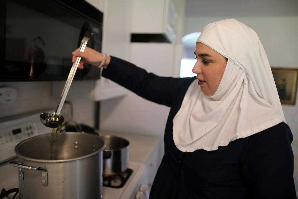 California "weed nun" Desiree Calderon, who goes by the name Sister Freya, ladles CBD salve made from hemp at Sisters of the Valley near Merced, California, U.S., April 18, 2017. Picture taken April 18, 2017. REUTERS/Lucy Nicholson