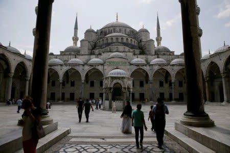 Tourists visit the Ottoman-era Sultanahmet mosque, also known as the Blue Mosque, in Istanbul, Turkey, July 18, 2016. REUTERS/Alkis Konstantinidis/File Photo