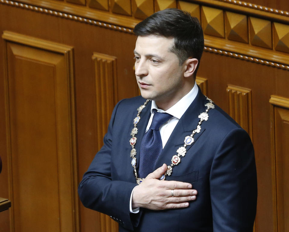 Ukrainian President-elect Volodymyr Zelenskiy sings the national anthem during his inauguration ceremony in Kiev, Ukraine, Monday, May 20, 2019. Television star Volodymyr Zelenskiy has been sworn in as Ukraine's next president after he beat the incumbent at the polls last month. The ceremony was held at Ukrainian parliament in Kiev on Monday morning. (AP Photo/Efrem Lukatsky)