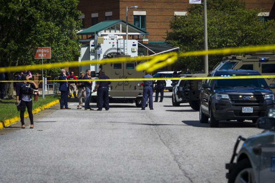 Police respond to the scene of a shooting at Heritage High School in Newport News, Va., on Saturday Sept. 20, 2021. Newport News police Chief Steve Drew said two students were shot and taken to the hospital and neither injury was thought to be life-threatening. The chief said authorities believe the suspect and victims knew one another but did not provide details. (AP Photo/John C. Clark)