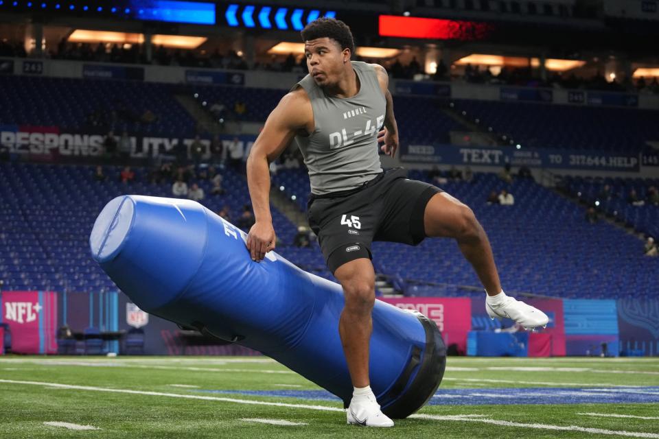 Feb 29, 2024; Indianapolis, IN, USA; Penn State defensive lineman Chop Robinson (DL45) works out during the 2024 NFL Combine at Lucas Oil Stadium. Mandatory Credit: Kirby Lee-USA TODAY Sports