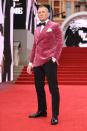 <p>Daniel Craig looked stylish in a red velvet jacket and bow-tie.</p>