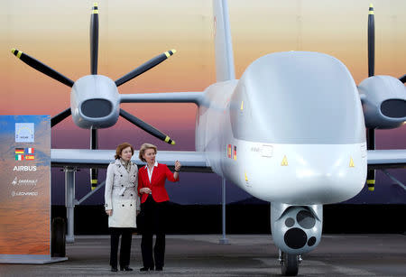 FILE PHOTO: German Defense Minister Ursula von der Leyen and French Minister of the Armed Forces Florence Parly stand next to full-scale mock-up of the future European MALE Drone as they visit the ILA Air Show in Berlin, Germany, April 26, 2018. REUTERS/Axel Schmidt/File Photo