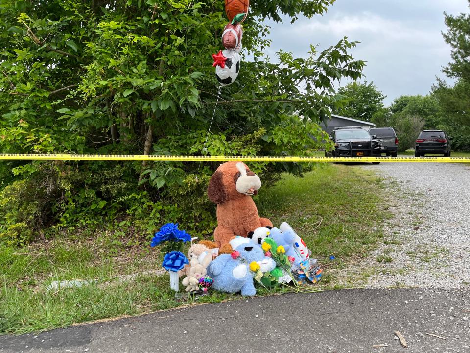 A memorial created outside the home where three young boys were shot and killed in Monroe Township.