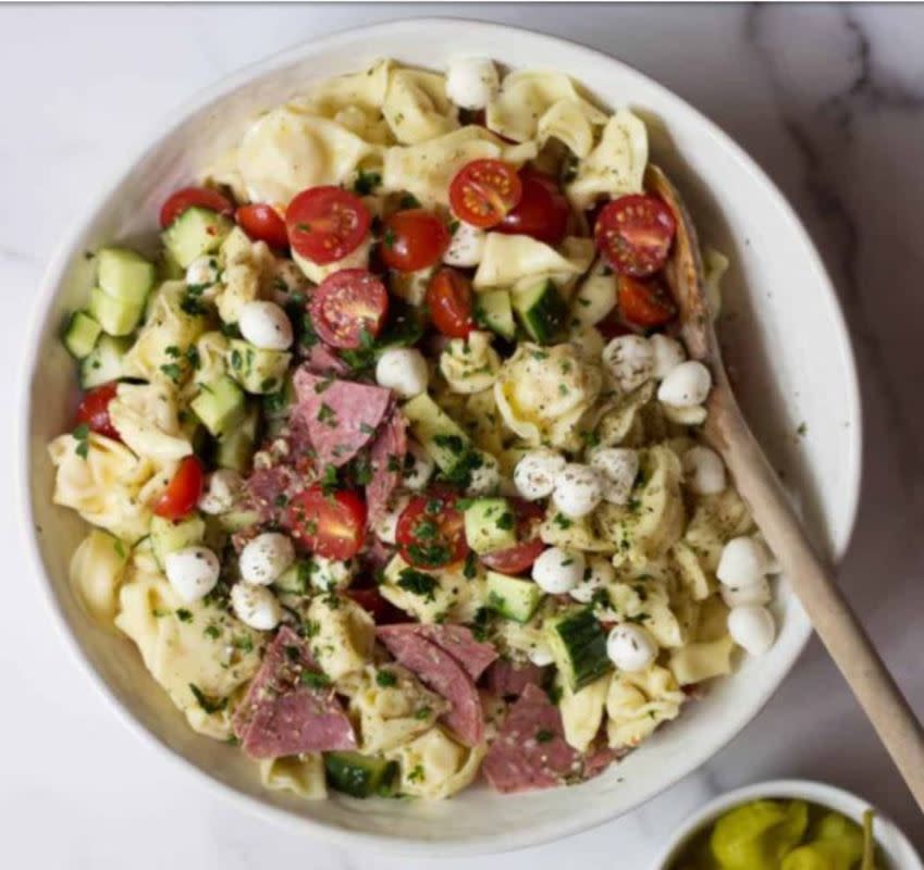 <p>The Gourmet RD</p><p>The best Italian pasta salad made with cheese filled tortellini, uncured salami, tomatoes, cucumber, fresh mozzarella and pepperoncini. It's all tossed in the best Italian dressing. </p><p><strong>Get the recipe: <a href="https://thegourmetrd.com/italian-tortellini-salad" rel="nofollow noopener" target="_blank" data-ylk="slk:Italian Tortellini Salad;elm:context_link;itc:0;sec:content-canvas" class="link rapid-noclick-resp">Italian Tortellini Salad</a></strong></p>