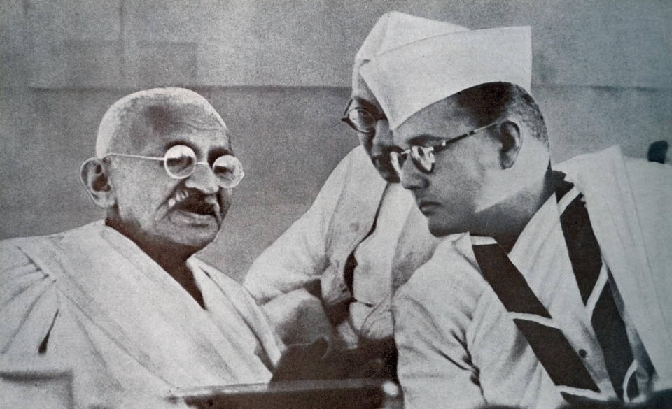 Mohandas K. Gandhi and Subhas Bose, prominent leaders of Indian Freedom Movement, at 51st Indian National Congress in 1938. Subhas Chandra Bose (1897 - 1945), Indian nationalist whose defiant patriotism made him a hero in India, whose attempt during World War II to rid India of British rule with the help of Nazi Germany and Imperial Japan left a troubled legacy. (Photo by: Universal History Archive/ Universal Images Group via Getty Images)