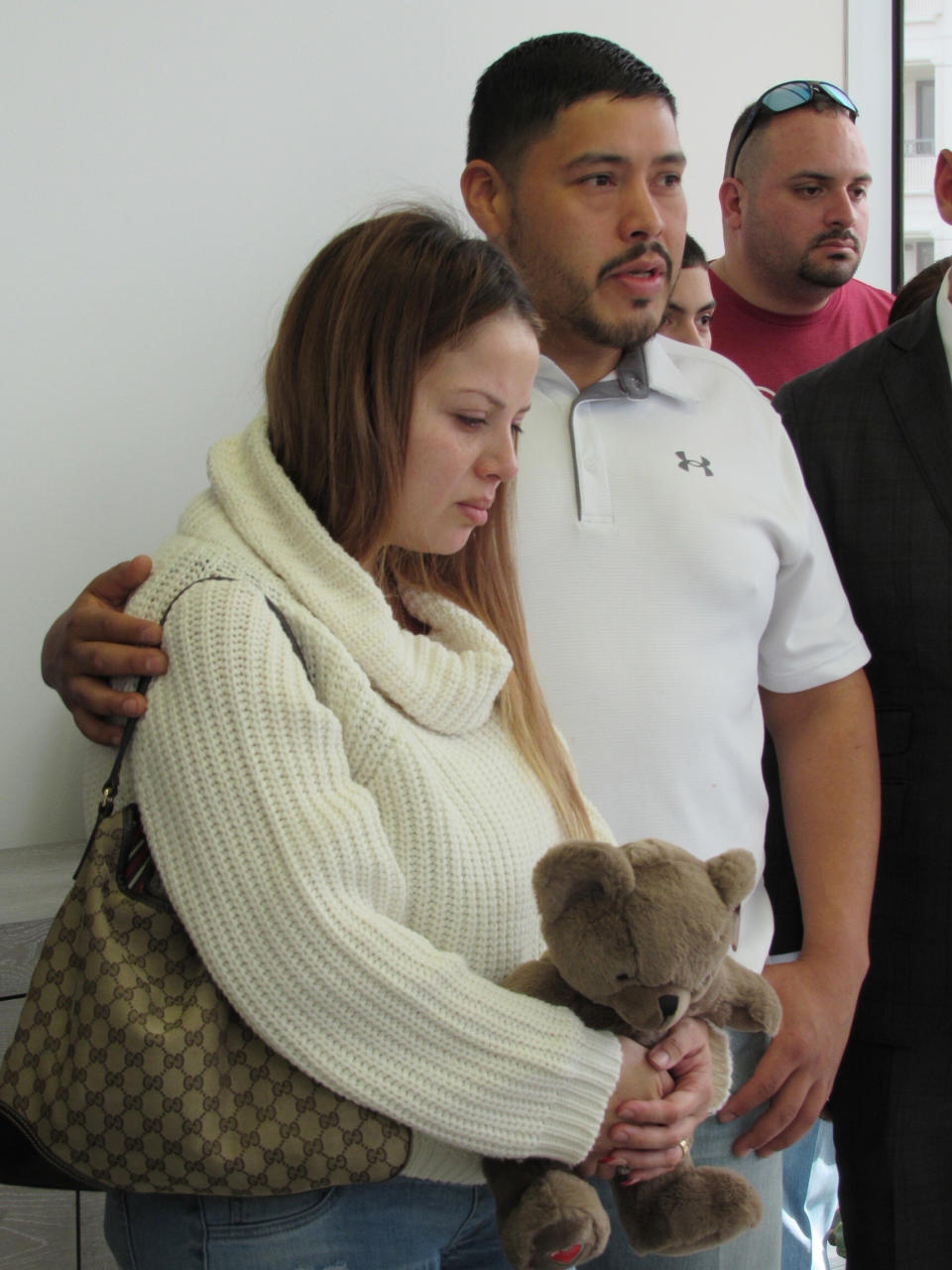 Arlene Alvarez's parents, Gwen Alvarez and Armando Alvarez are seen during a news conference Wednesday, Feb. 16, 2022, in Houston, Texas. Arlene a 9-year-old girl died on Tuesday, Feb. 15, after being mistakenly shot by a robbery victim on Monday evening in Houston. (AP Photo/Juan A. Lozano)