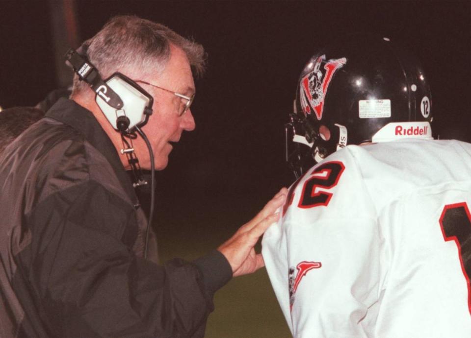 Gawen Stoker speaks with a player during a timeout during September 22, 2000 game. Stoker was head coach at BEA for 23 years.
