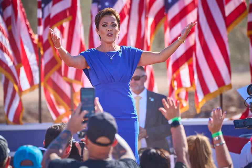 Gubernatorial candidate Kari Lake takes the stage during former President Donald Trump's rally at Legacy Sports Park in Mesa on Sunday, Oct. 9, 2022.