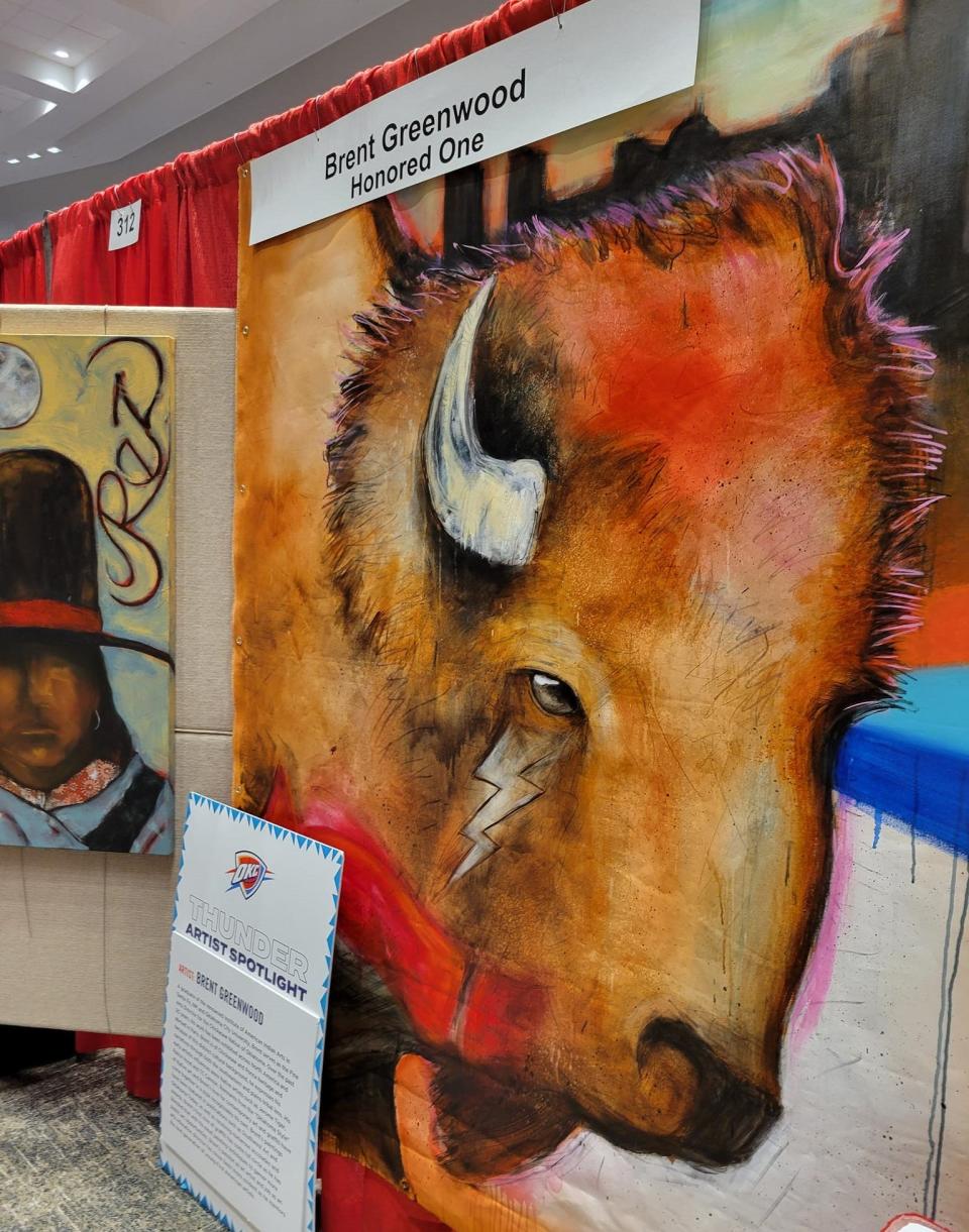 Oklahoma artist Brent Greenwood displays his large-scale painting of a bison head at the March 22 Red Earth Festival at the National Cowboy & Western Heritage Museum in Oklahoma City. The Chickasaw and Ponca artist painted it live at a November 2023 OKC Thunder game at Paycom Center in honor of Native American Heritage Night.