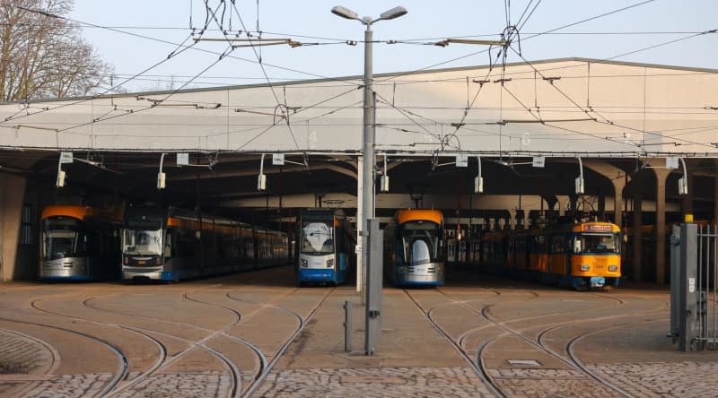 A view of streetcars from Leipzig's public transport company parked at the Angerbruecke streetcar station. Much of Germany's public transport will remain out of service on Friday, as the second round of warning strikes by the trade union Verdi climaxes. Jan Woitas/dpa