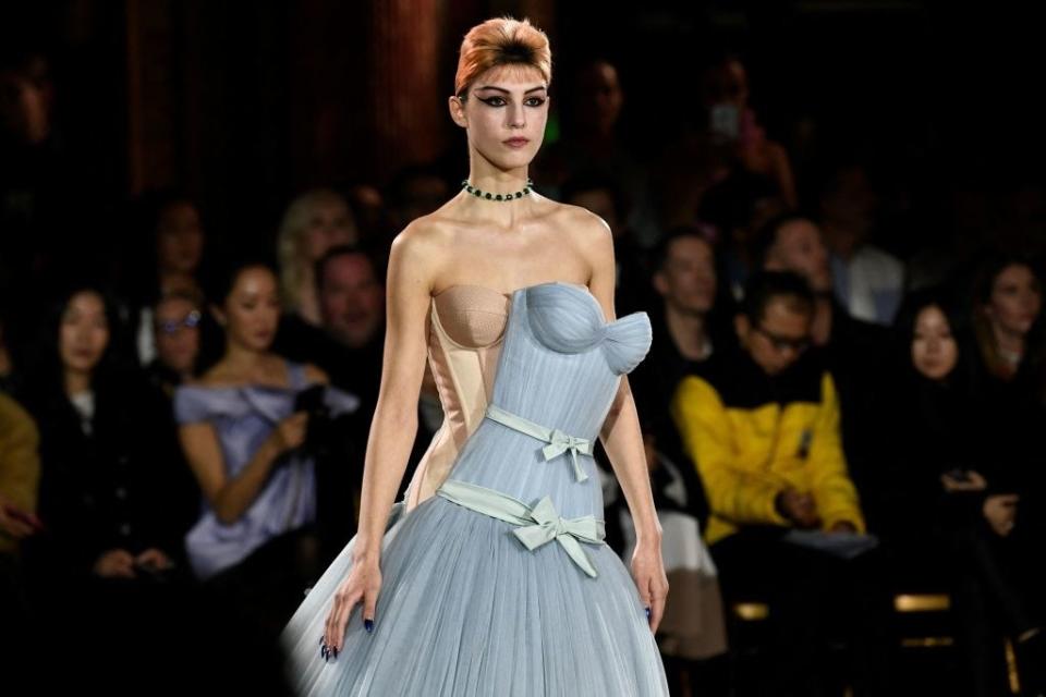 model with a dress attached askew